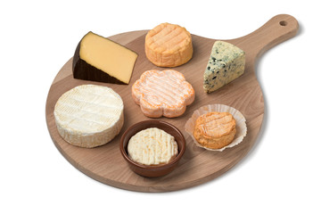 Wooden cheese board with a variety of cheeses