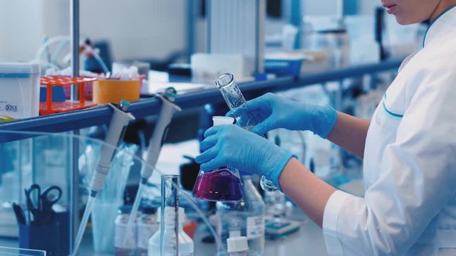 Medical Technology Laboratory Medical Science in Hospital. The doctor researched the vaccine against the virus. Examples of medical clinic technology, wearing safety glasses, testing liquid in tube.