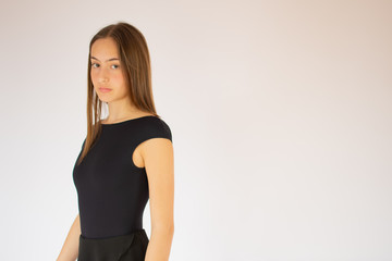 Young beautiful ballet dancer looking into the camera
