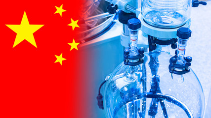 Laboratory bioreactor on the background of the flag of China. Microbiological research in PRC....