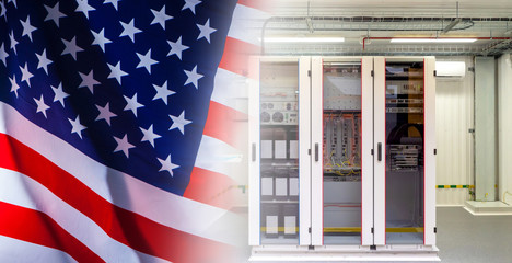 Server station on the background of the American flag. Development of new technologies in the United States. Technical support for American enterprises. Development of high-quality equipment.