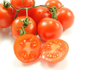 Beautiful natural vegetables tomatoes on a branch