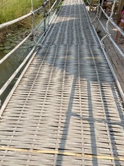 Fototapeta premium wood bridge and bamboo bridge in farmland for visitor