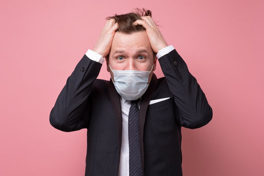 Young Caucasian Man In A Medical Mask Os Being Stressed With Coronavirus Pandemic