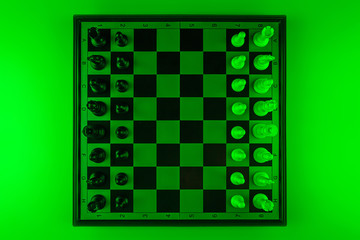 Chess pieces on a chessboard, game. The concept of confrontation, career, promotion, startup. flat lay.