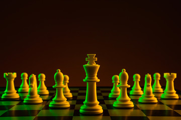 Chess pieces on a chessboard, construction, game. The concept of confrontation, career, competition, startup, battle of brains.