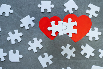 Red hearts and puzzle pieces. 