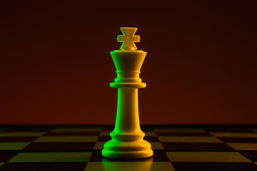 Chess pieces, king on a chessboard, game. The concept of confrontation, career, competition, startup, battle of brains.