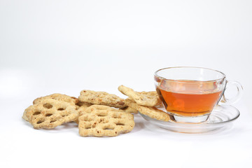 Kuih Cincin rice flower brown sugar sweet cracker snacks with cup of transparent licker tea