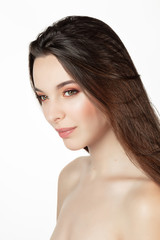 Fototapeta premium Portrait of an attractive young woman under white background