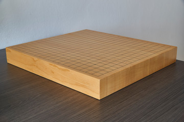 Empty wooden goban on the desk, diagonal view