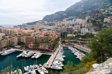 Naklejka premium Precious apartments and harbor with luxury yachts in the bay,Monte Carlo,Monaco,Europe