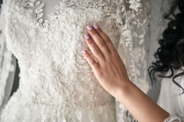 Morning of the bride when she wears a beautiful dress, woman getting ready before wedding ceremony