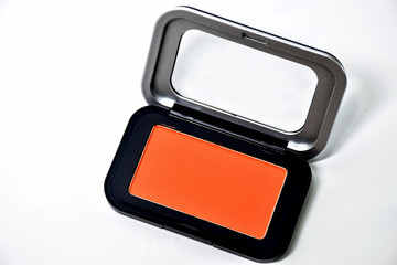 Orange Blush in black metal cartridge on white background.