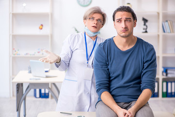 Fototapeta premium Young patient visiting doctor in hospital