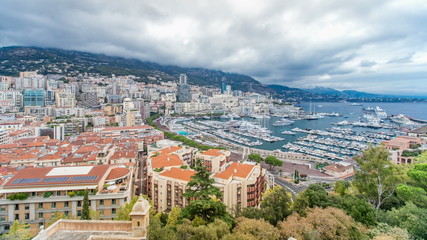Monte Carlo city aerial panorama timelapse. View of luxury yachts and apartments in harbor of Monaco, Cote d'Azur.