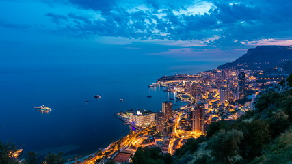 Aerial top view of Monaco from the grand corniche road day to night timelapse, Monaco France