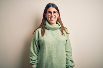 Young beautiful woman wearing casual sweater standing over isolated white background with a happy and cool smile on face. Lucky person.