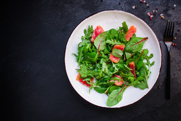 healthy salad leaves mix, salmon or tuna (delicious snack) pescatarian, keto or paleo diet menu concept. food background. top view. copy space