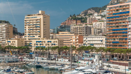 Fototapeta na wymiar Monte Carlo city aerial panorama timelapse. View of luxury yachts and apartments in harbor of Monaco, Cote d'Azur.