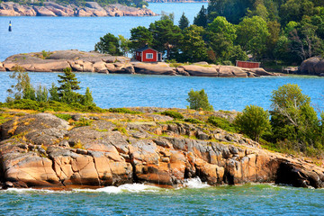 Aland archipelago in  Baltic Sea with its tiny rocky islands of red granite.