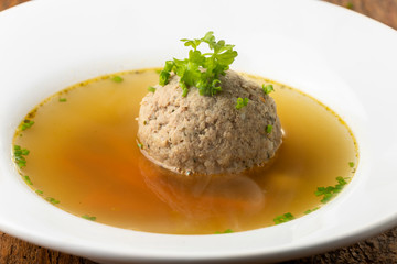 bavarian liver dumpling soup on wood