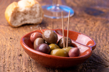 mixed olives on dark wood