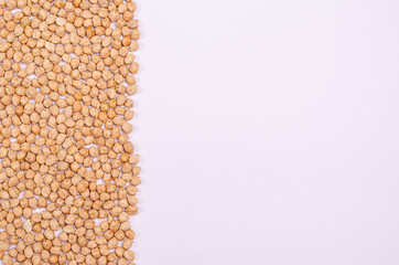 Dry chickpeas for vegans on a white background. Copy space