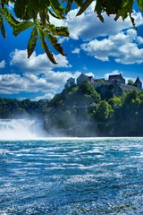 the famous rhine falls in the swiss near the city of Schaffhausen - sunny day and blue sky