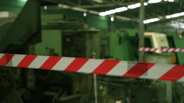 Hazardous areas and restricted areas in factory are installed with sticky white warning tape, red warning symbol and caution.