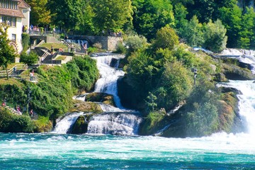 Naklejka premium the famous rhine falls in the swiss near the city of Schaffhausen - sunny day and blue sky