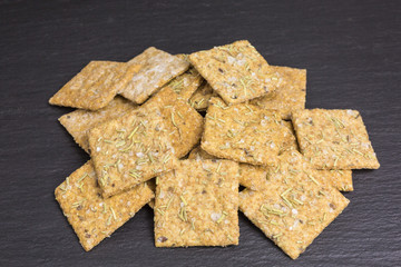 heap of crispy cracker with rosemary and sea salt