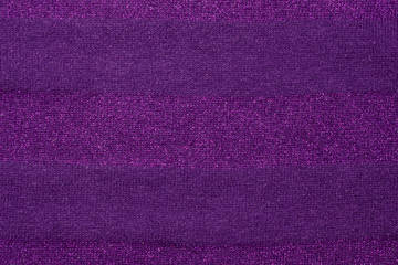 Perple knitted fabric texture as background. Beautiful pattern.