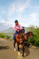 rider on horseback ride in lush nature