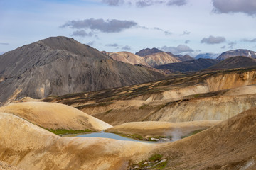 Landmannalaugar Colorful mountains on the Laugavegur hiking trail. Iceland. The combination of layers of multi-colored rocks, minerals, grass and moss