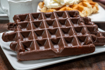 Tasty Belgian dessert, Brussels waffles with chocolade and whipped cream