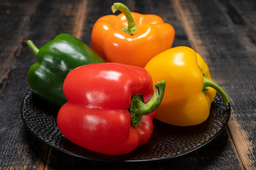 Fresh red, orange, green and yellow sweet bell paprika