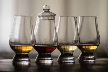 Tasting of flight of Scotch whisky from special tulip-shaped glasses on distillery in Scotland, UK