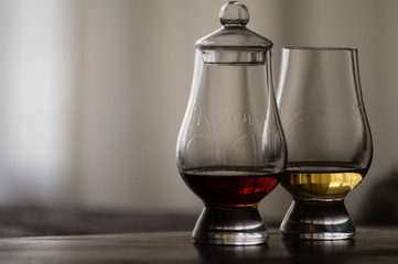 Tasting of flight of Scotch whisky from special tulip-shaped glasses on distillery in Scotland, UK