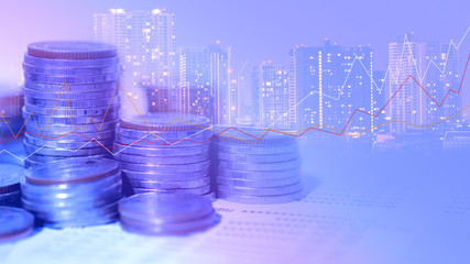 Financial investment concept, Double exposure of city night and stack of coins for finance investor, Forex trading candlestick chart economic , ECN Digital economy, business, Poke lights, SME.