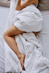 cropped photo of unrecognizable woman lying on bed, sleep. dreams, sleeping, morning concept
