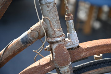 Partial view of a historic bicycle brake. A rusty, old mudguard. 