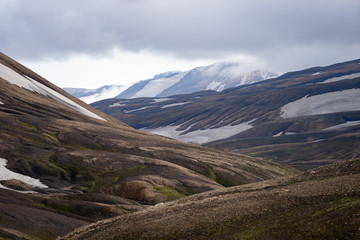 Beautiful landscape with glacier, hills and moss on the Fimmvorduhals trail near Landmannalaugar of summer sunny day, Iceland