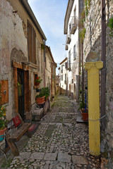 Montesarchio, Italy, 02/29/2020. A narrow street between the old houses of a medieval village.