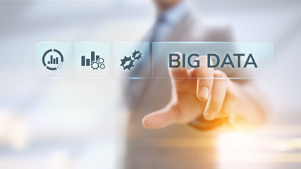 Big data analytics technology internet technology concept. Businessman pressing button on virtual screen.
