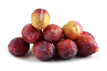 Fototapeta na wymiar Red plums isolated on white