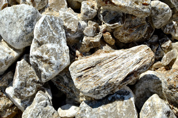 Natural gray gypsum stone. Close up image of stones with black and white. Industrial mining area. Limestone mining, quarry - Image