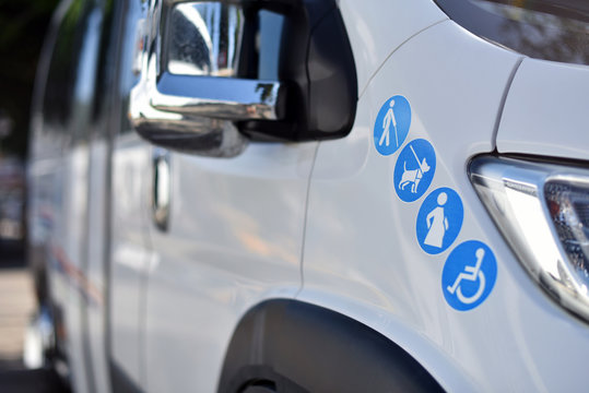 Signs elderly, pets, pregnant and disabled on shuttle minibus