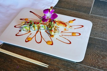 Ocean fried shrimp tempura roll sushi on a plate at a Japanese restaurant © eqroy