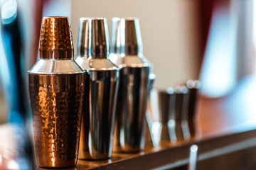 professional cocktail shaker set, bar equipment arranged on the bar counter